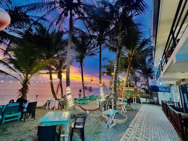 The terrace at sunset with the string lights on